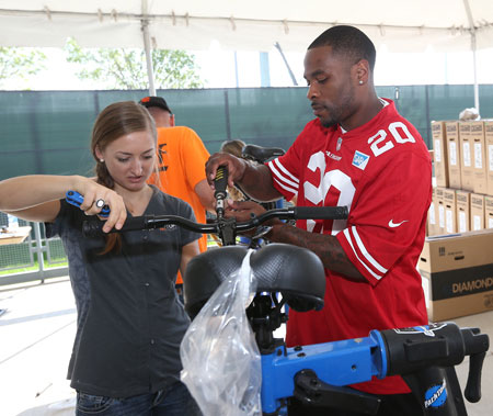 49ers Help Build Bikes for Children