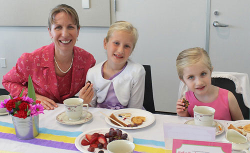 Ladies Sip Tea with Pinky Fingers Down at Etiquette Party Ladies Sip Tea with Pinky Fingers Down at Etiquette Party